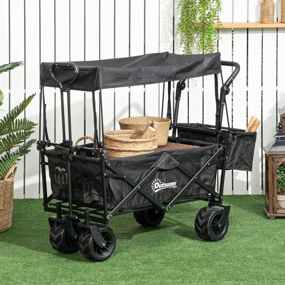 Black outdoor push pull wagon stroller cart with canopy and multiple storage compartments