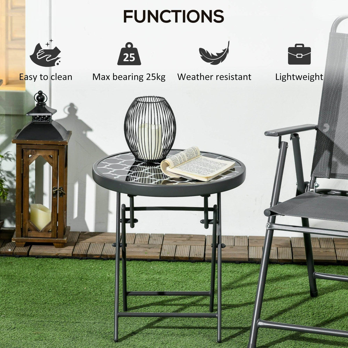Black round folding patio side table with patterned glass top and cross-brace frame