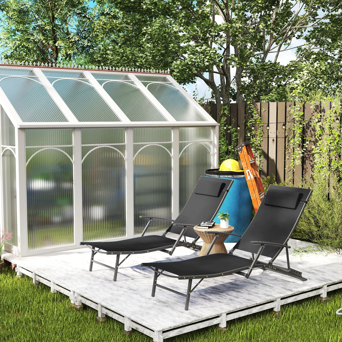 Two black adjustable back sun loungers with texteline mesh seats and padded pillows