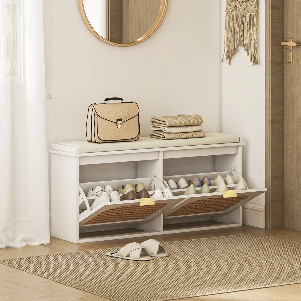 White shoe bench with padded top, open shelves, and two flip drawers for entry storage