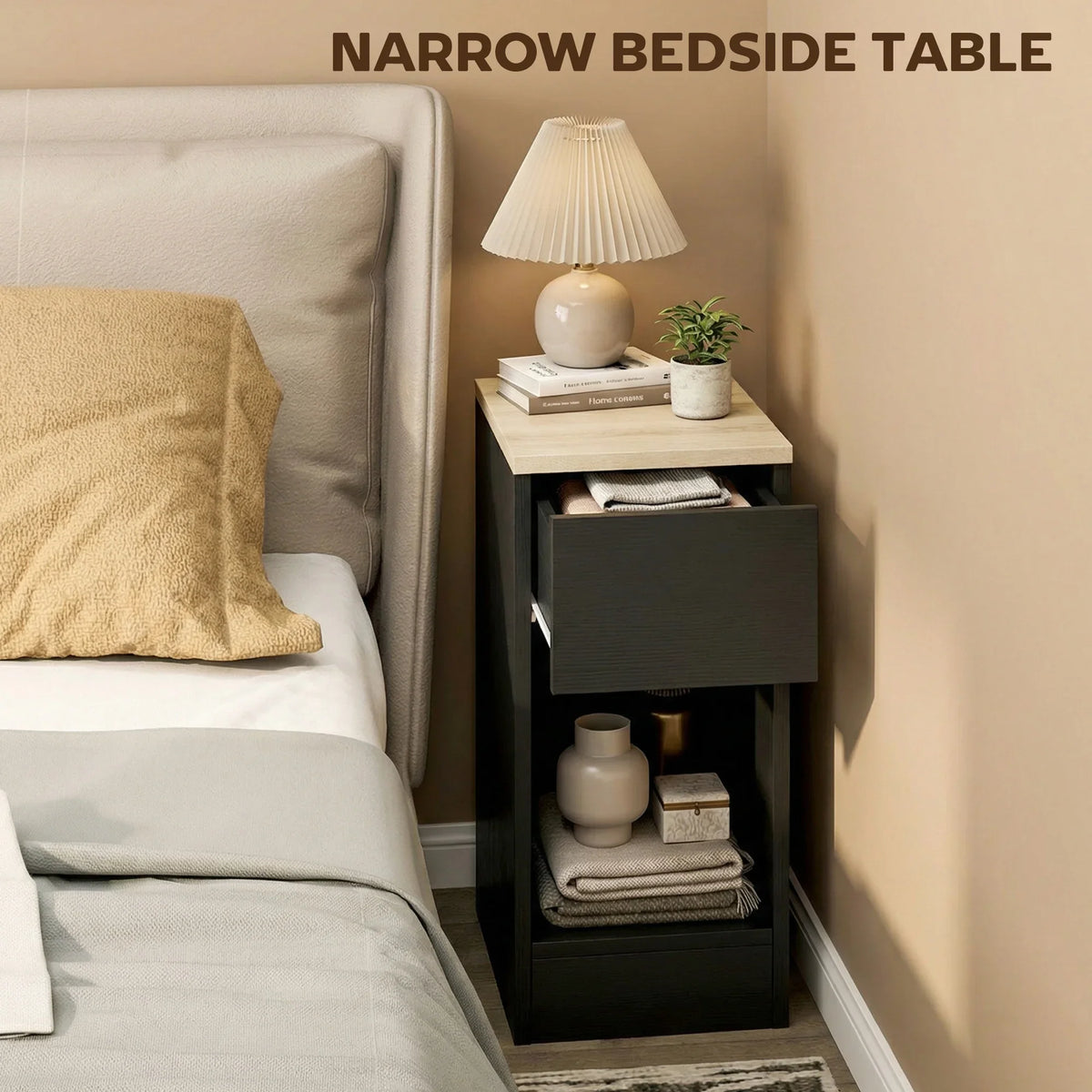 Narrow black bedside storage table with light wood-effect top, drawer, and open shelf