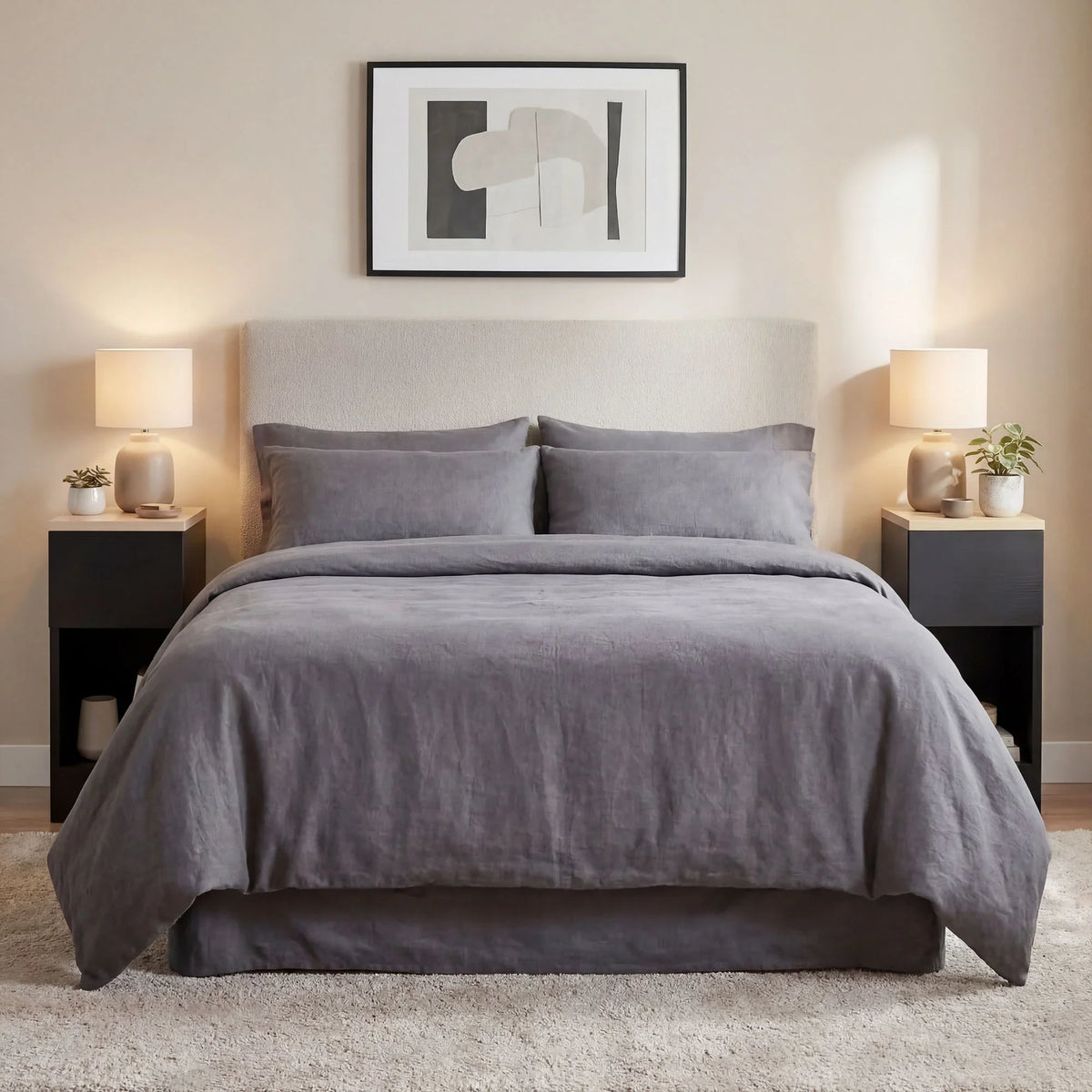 Black bedside tables with light wood-effect tops and lower open storage shelves