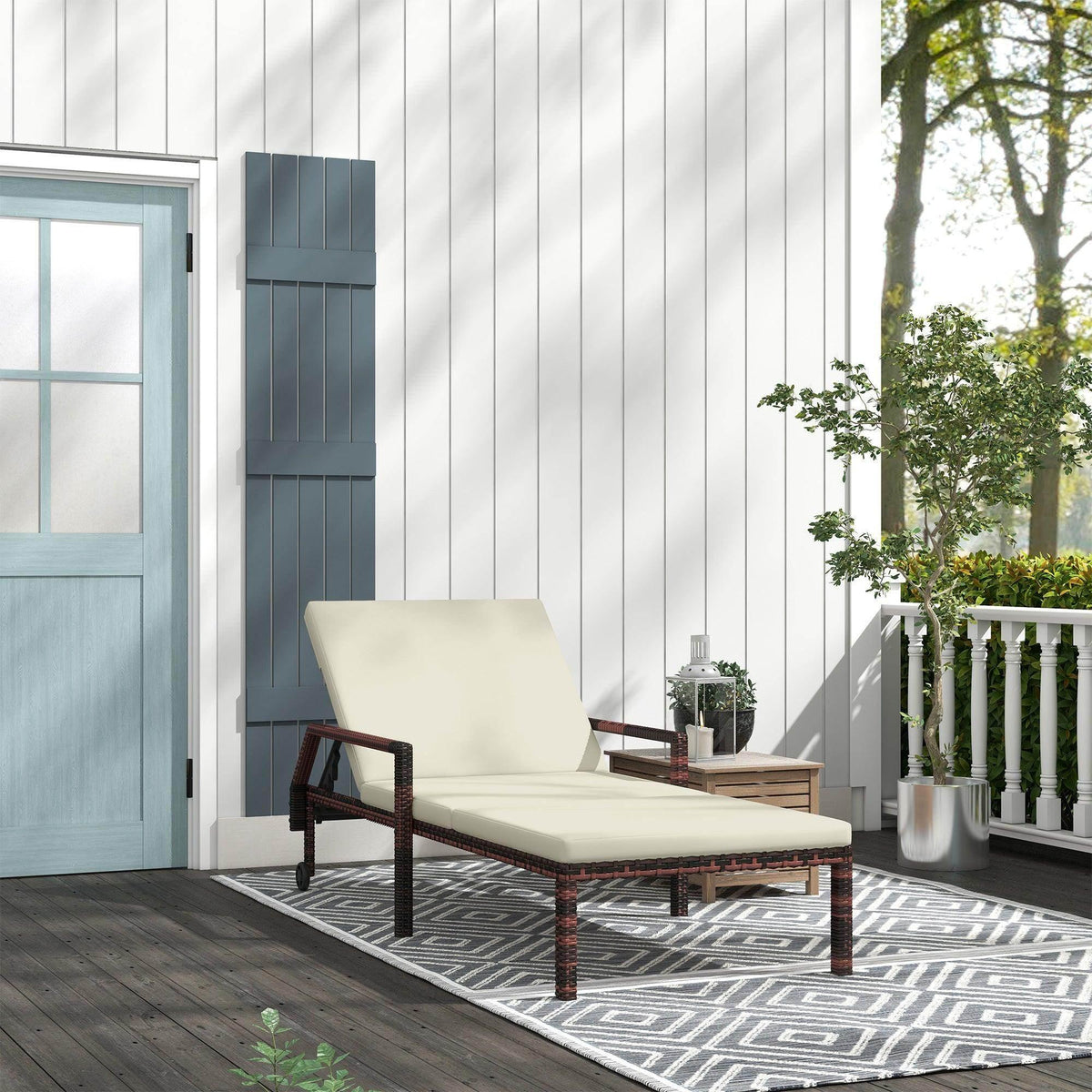 Outdoor rattan wicker chaise lounger with light cream cushion and dark frame on wheels