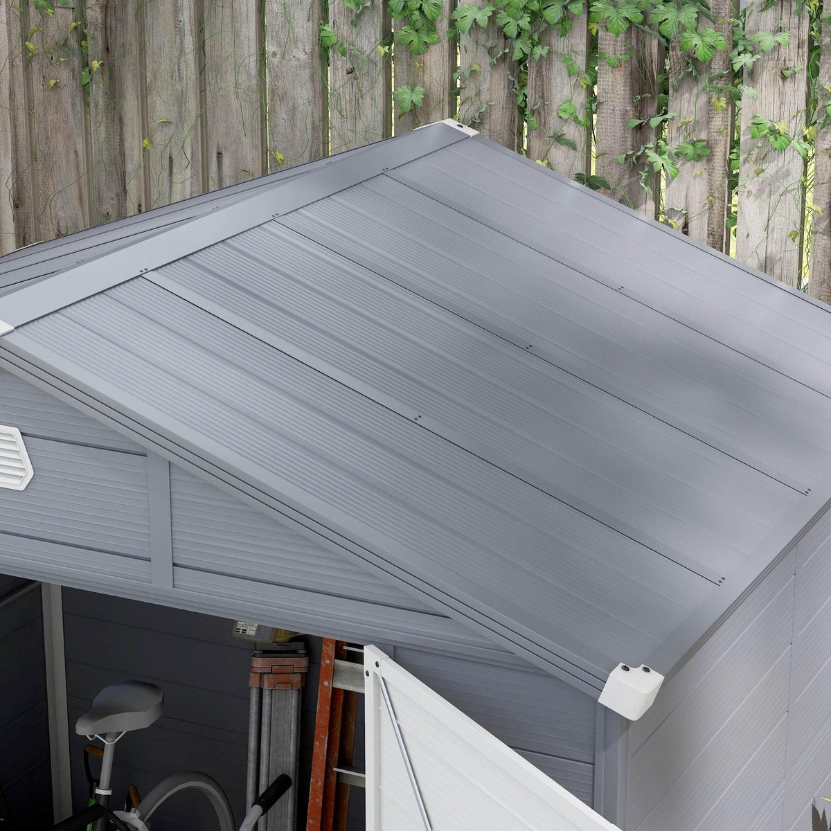 Grey storage shed roof with side wall panels and a small ventilation vent