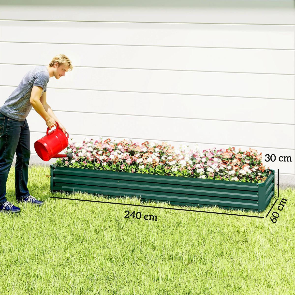 Long dark green raised garden bed planter with open top and colorful flower bed