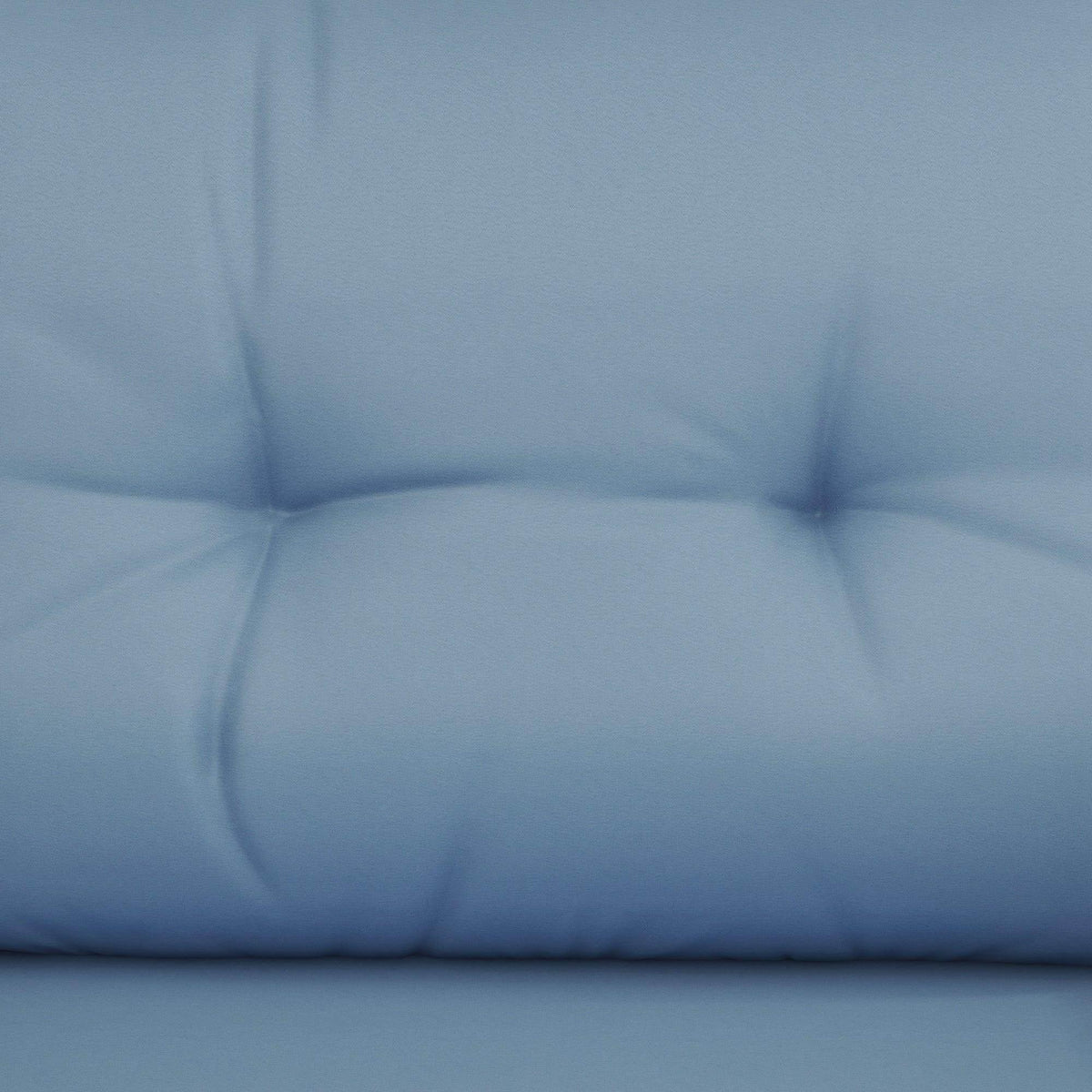 Blue padded outdoor sofa cushion with tufted seat back detail