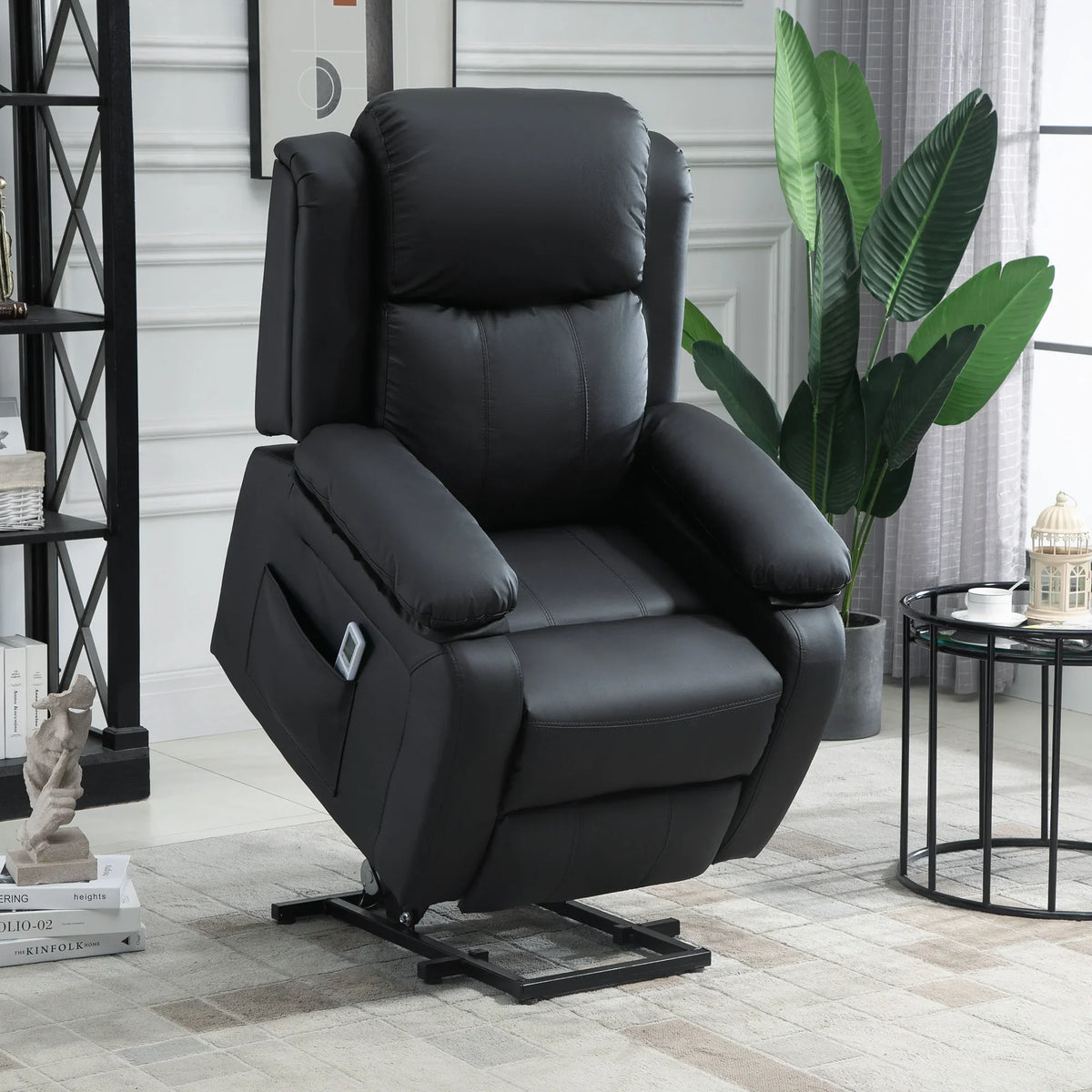 Black power lift recliner chair with cushioned arms and footrest, motorized base