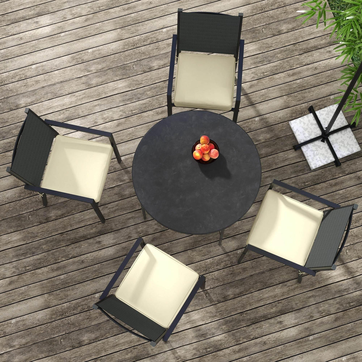 Four beige seat cushions with tie straps for patio chairs on a wood deck