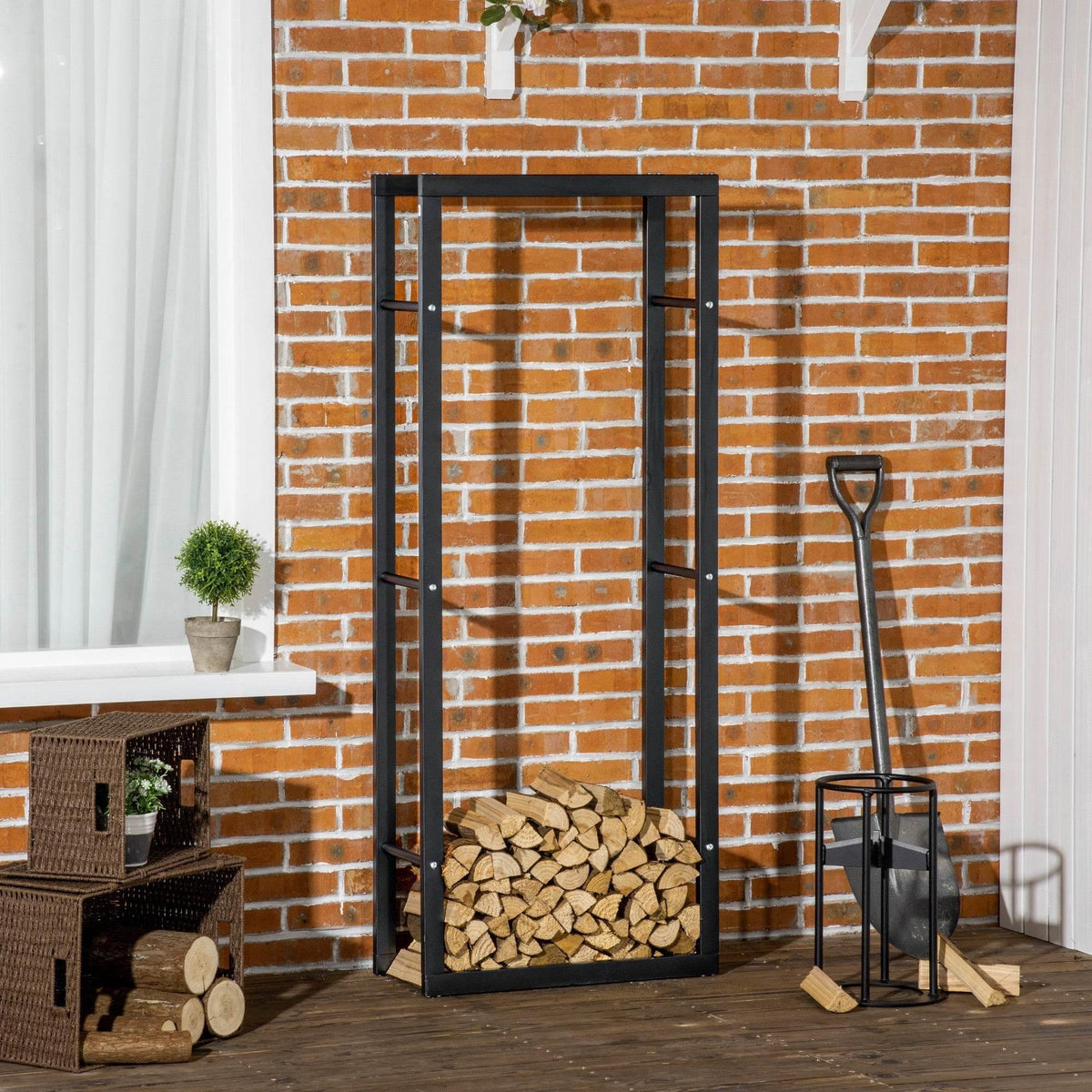 Tall black metal firewood rack with open frame and stacked logs at base