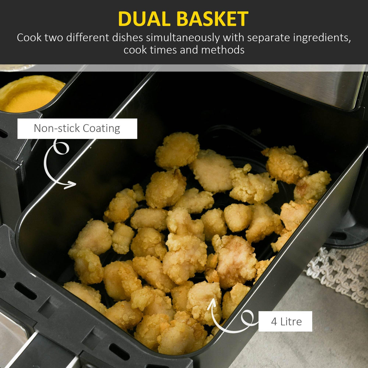 Dual-zone air fryer basket open with golden fried chicken bites in a nonstick tray