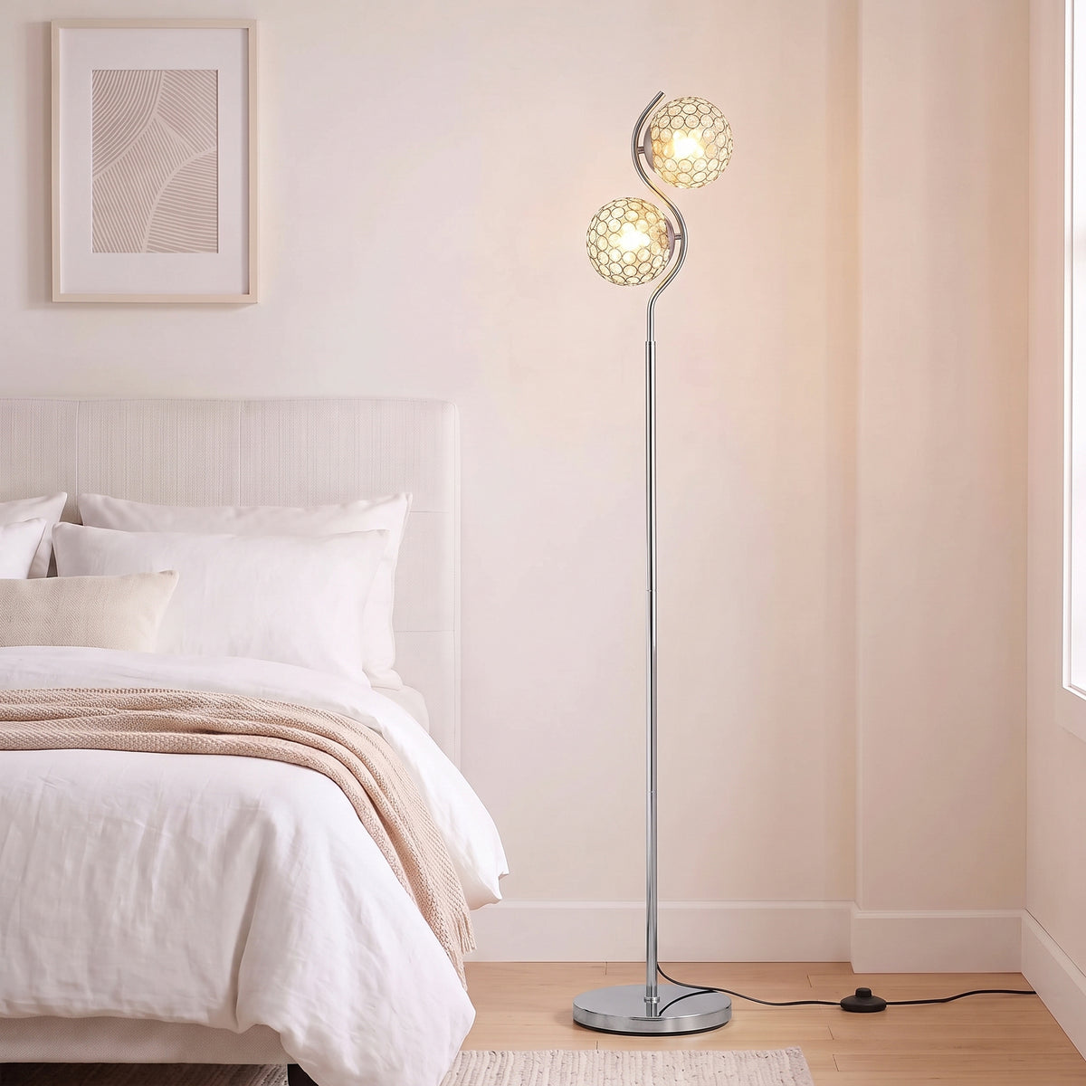 Silver floor lamp with two crystal globe shades and a round base stand.