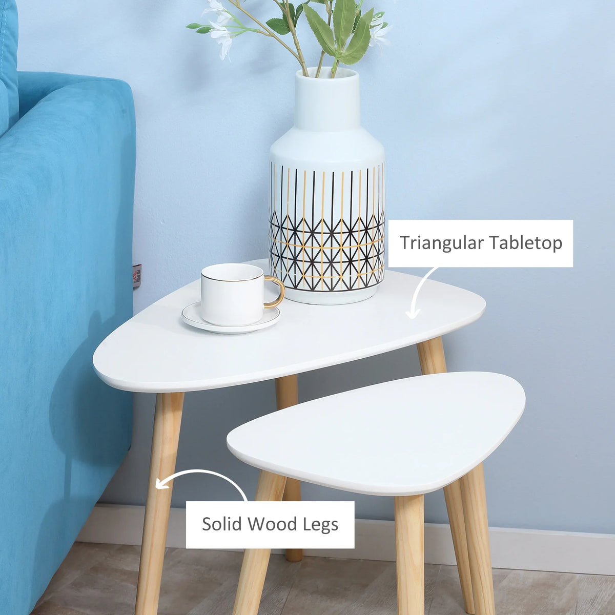 White triangular coffee table with smooth tabletop and solid wood legs