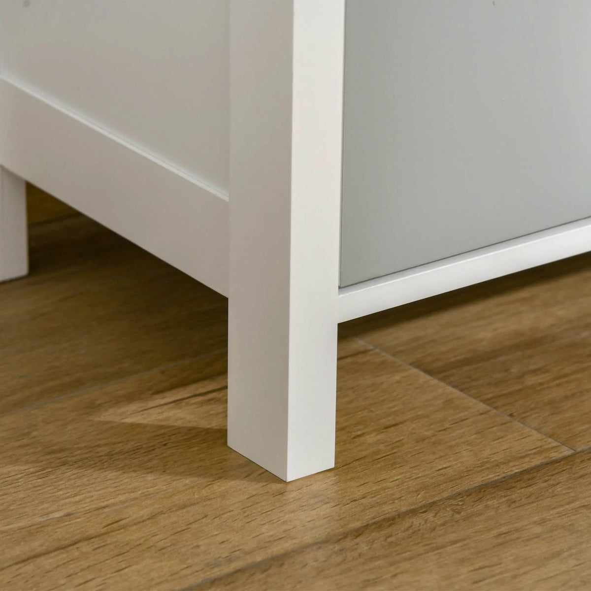 White nightstand base and legs with drawer frame, showing sturdy bottom support