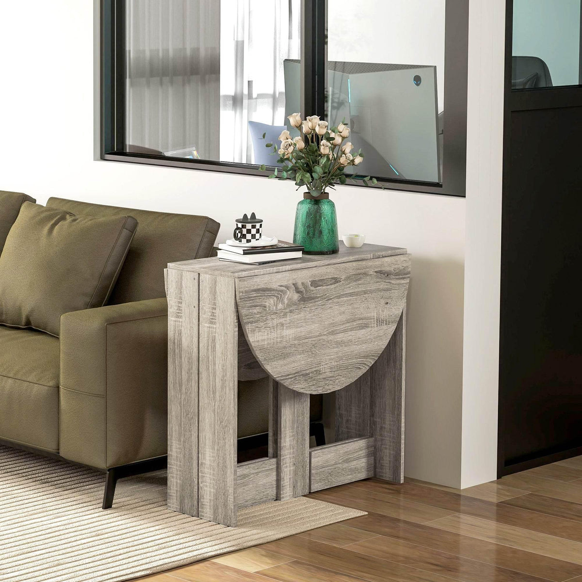 Grey folding drop-leaf dining table with curved tabletop edge and open leg frame