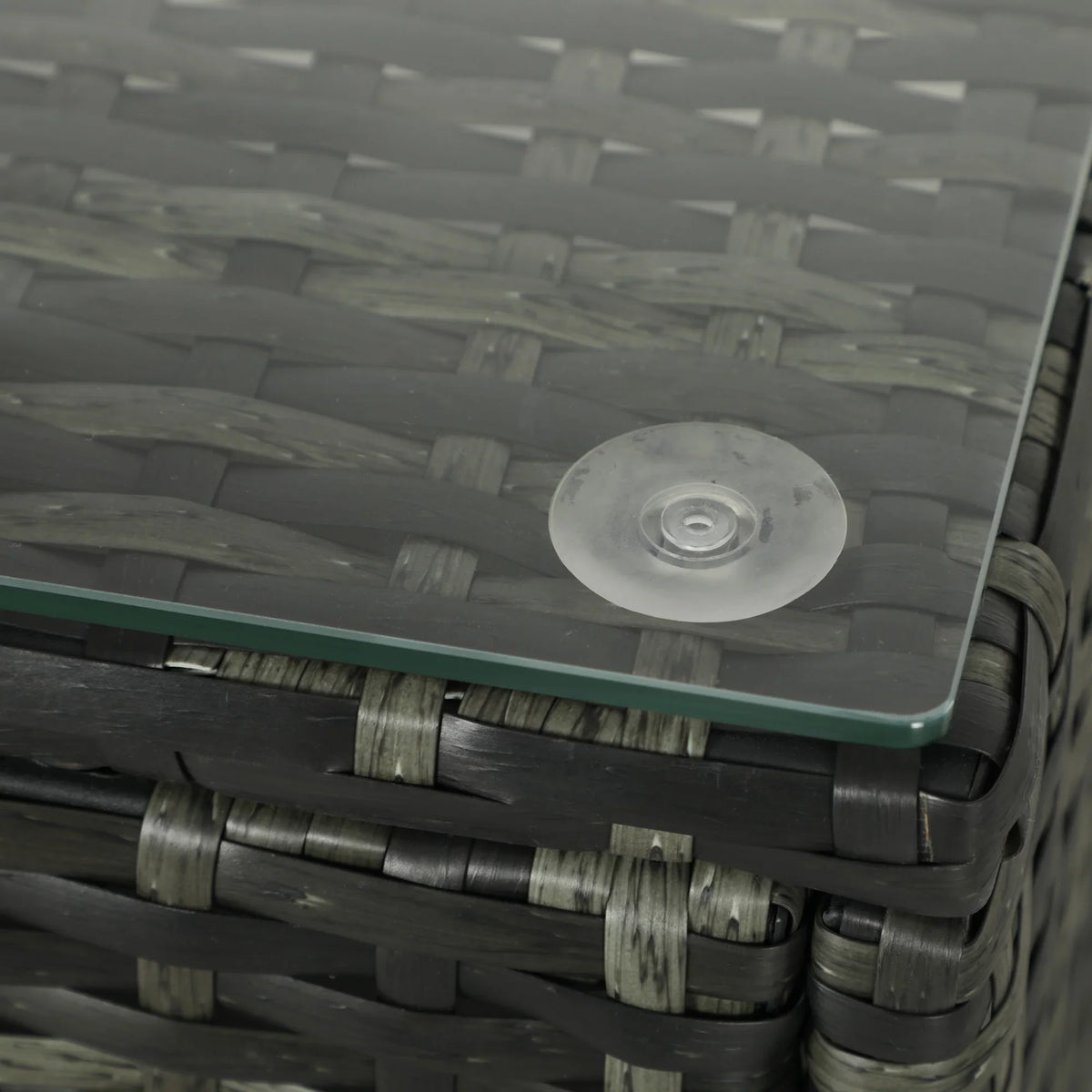 Grey rattan glass table top with round hardware detail