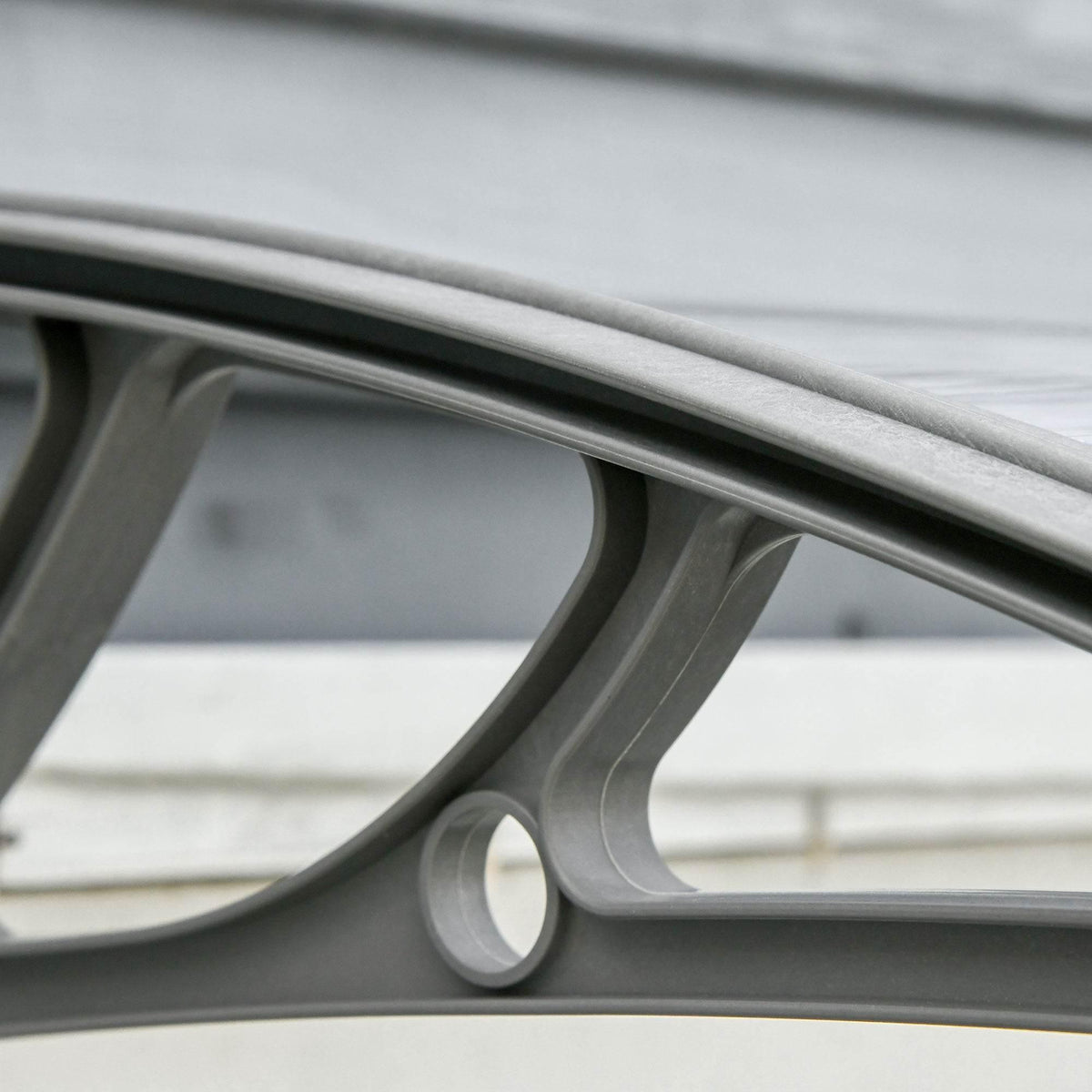Arched frame rail with PP support bracket for clear door canopy awning, close-up