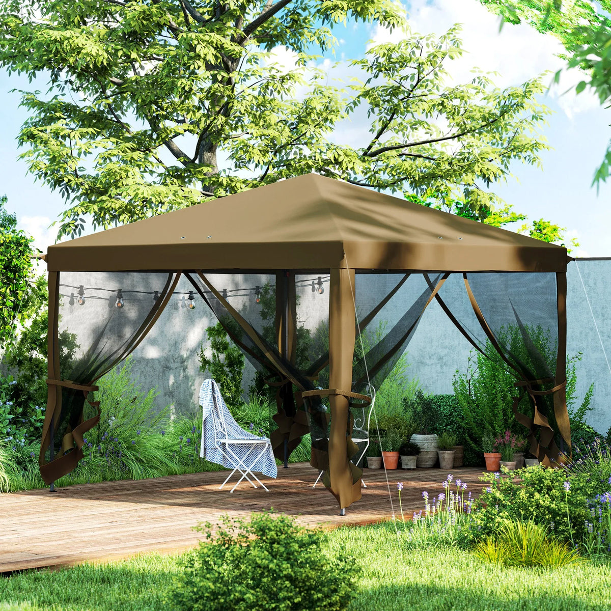 Khaki pop-up gazebo with mesh curtains over a wooden patio area