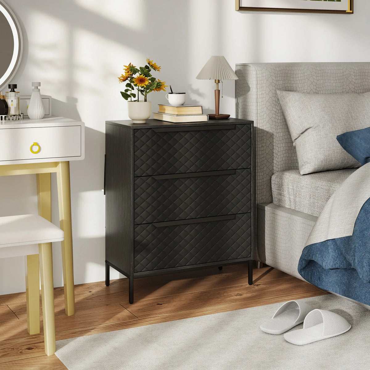 Black chest of drawers with quilted 3 fabric drawers and wood-effect top, front view