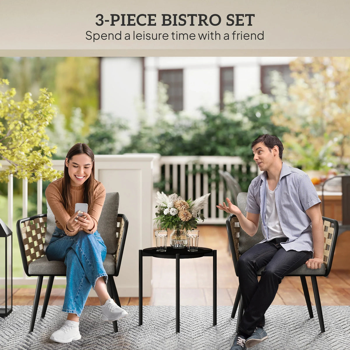 3-piece outdoor bistro set with two gray cushioned chairs and round glass-top table