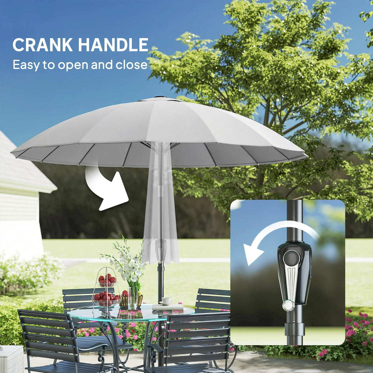Light grey patio parasol open with crank handle on the dark center pole