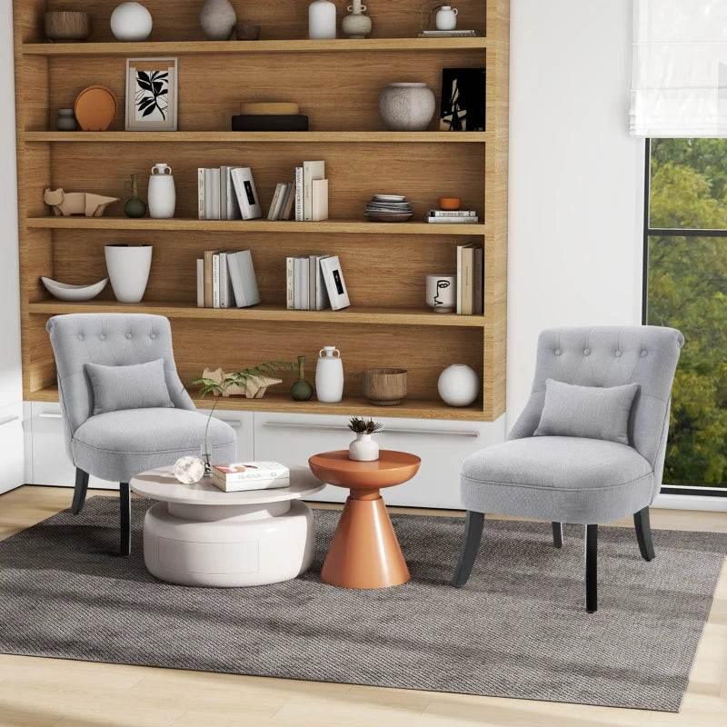 Grey upholstered single tub chair with tufted back, matching cushion, and solid wood legs.