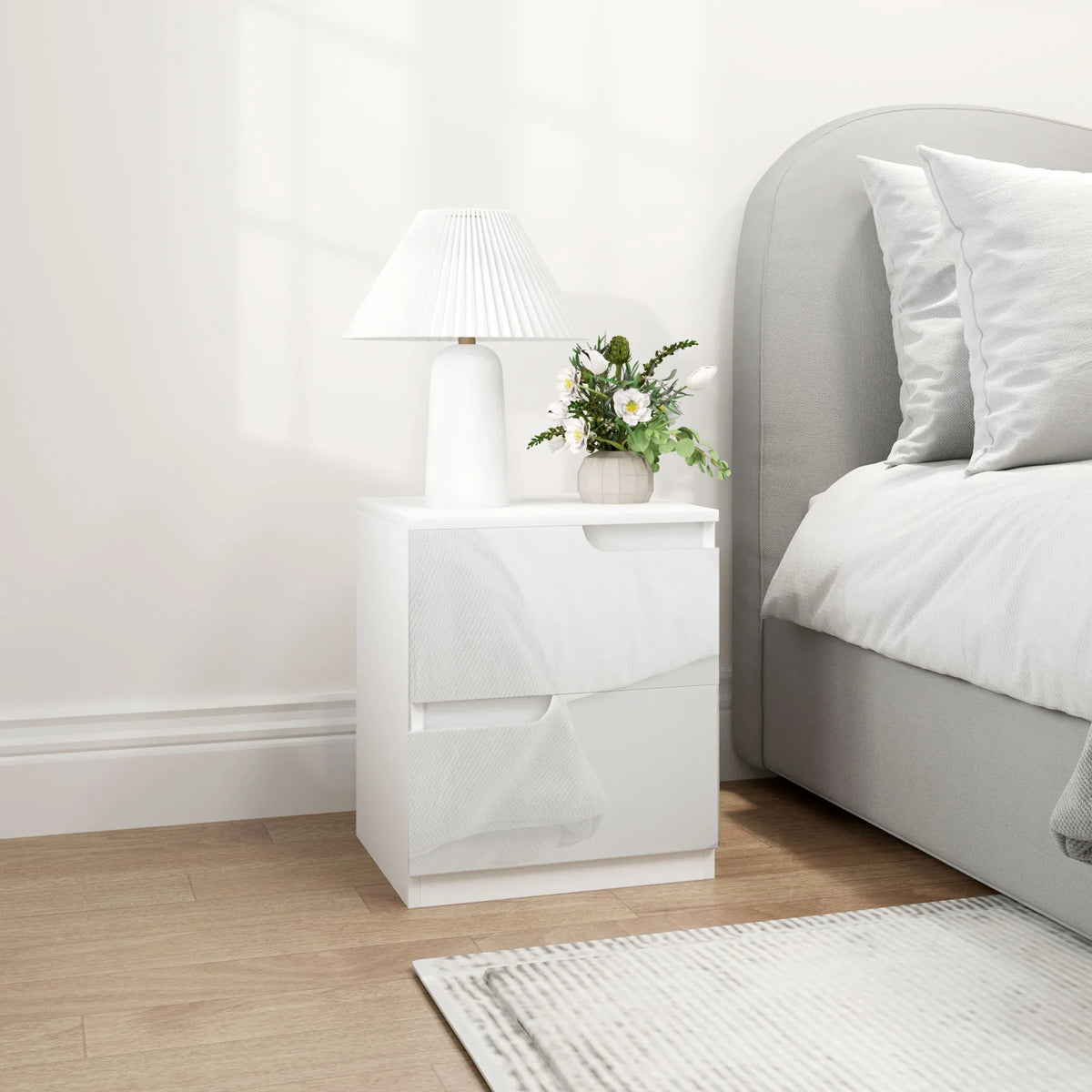 High-gloss white bedside table with two drawers and rounded foot pads
