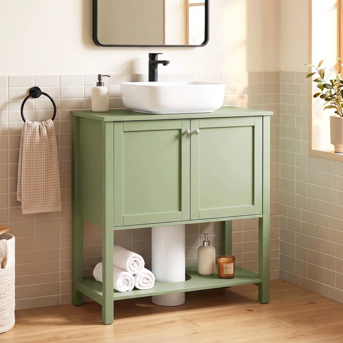 Green bathroom cabinet with two doors, open lower shelf, and top sink area.