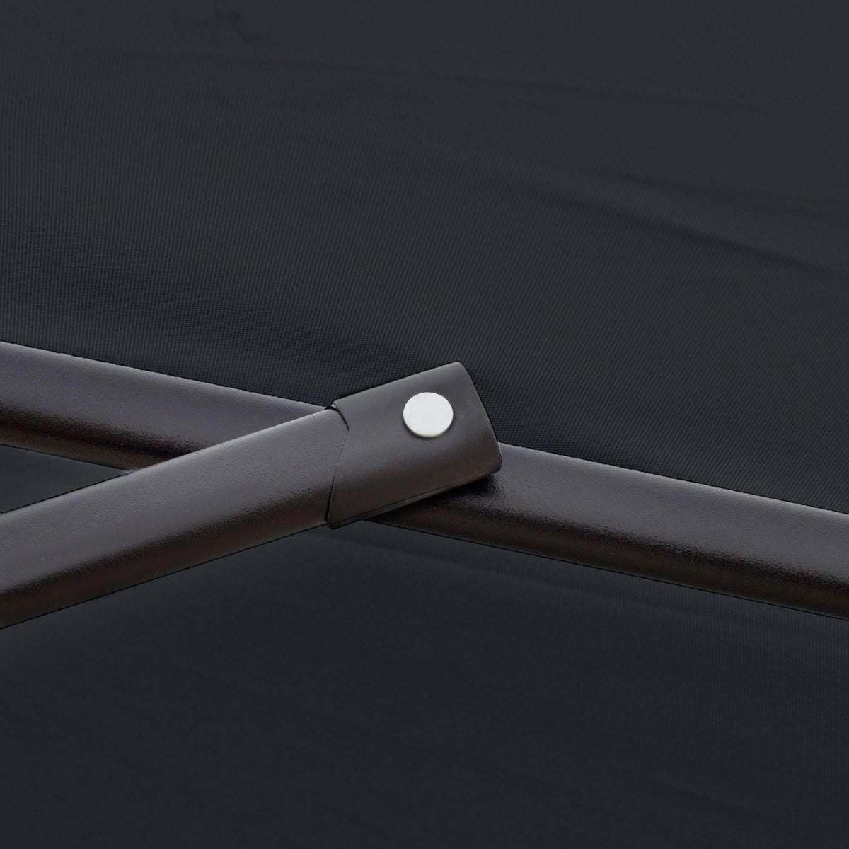 Cantilever umbrella canopy support arm with dark fabric edge and round fastener