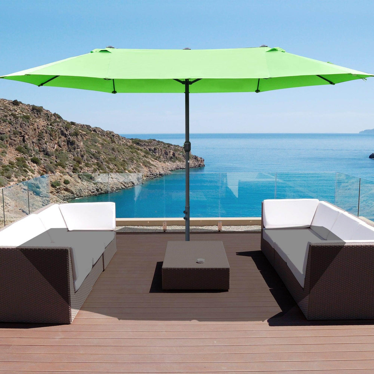 Green double-sided patio sun umbrella with central pole over outdoor seating