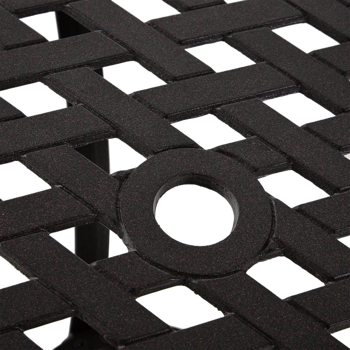 Close-up of black cast-aluminum lattice tabletop with circular cutout