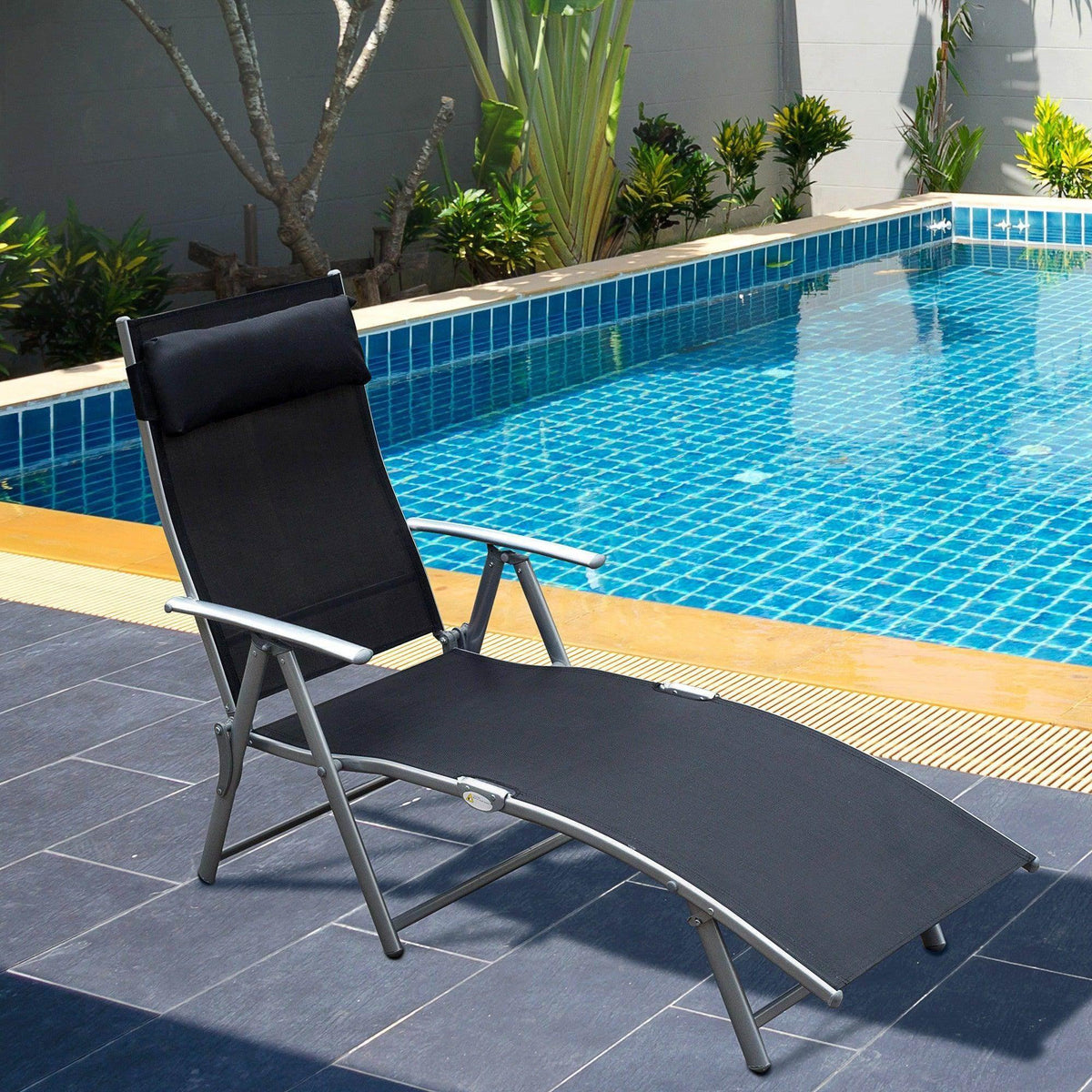 Black foldable sun lounger chair with padded back, extended seat, and armrests