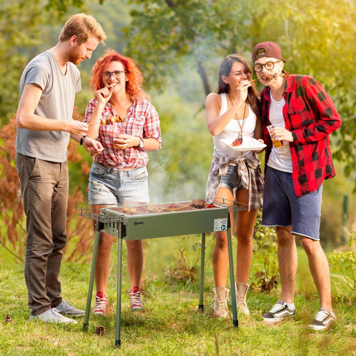 Charcoal BBQ grill on four legs with grilling grate and food, outdoors