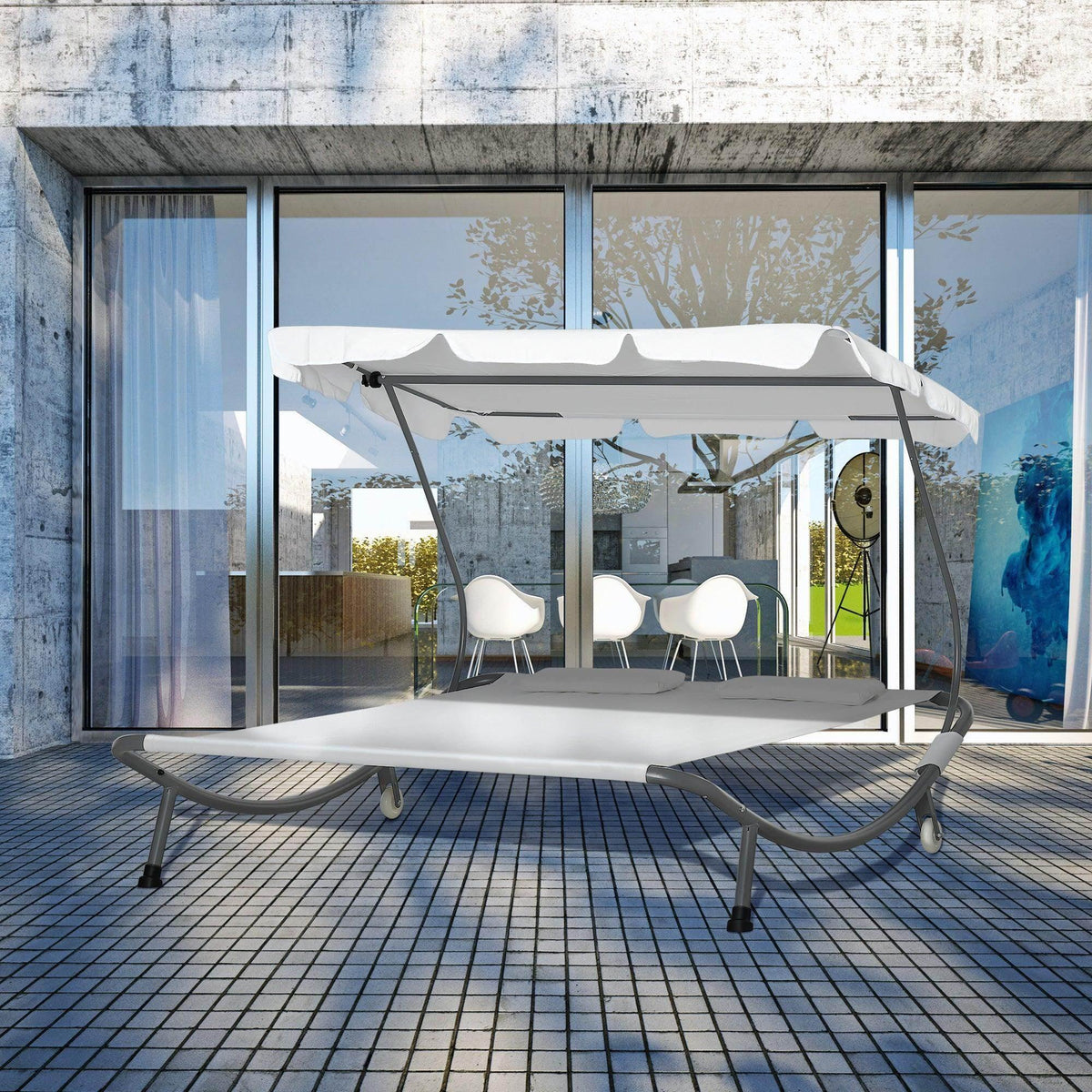 White double sun lounger with canopy and two padded pillows on a metal frame