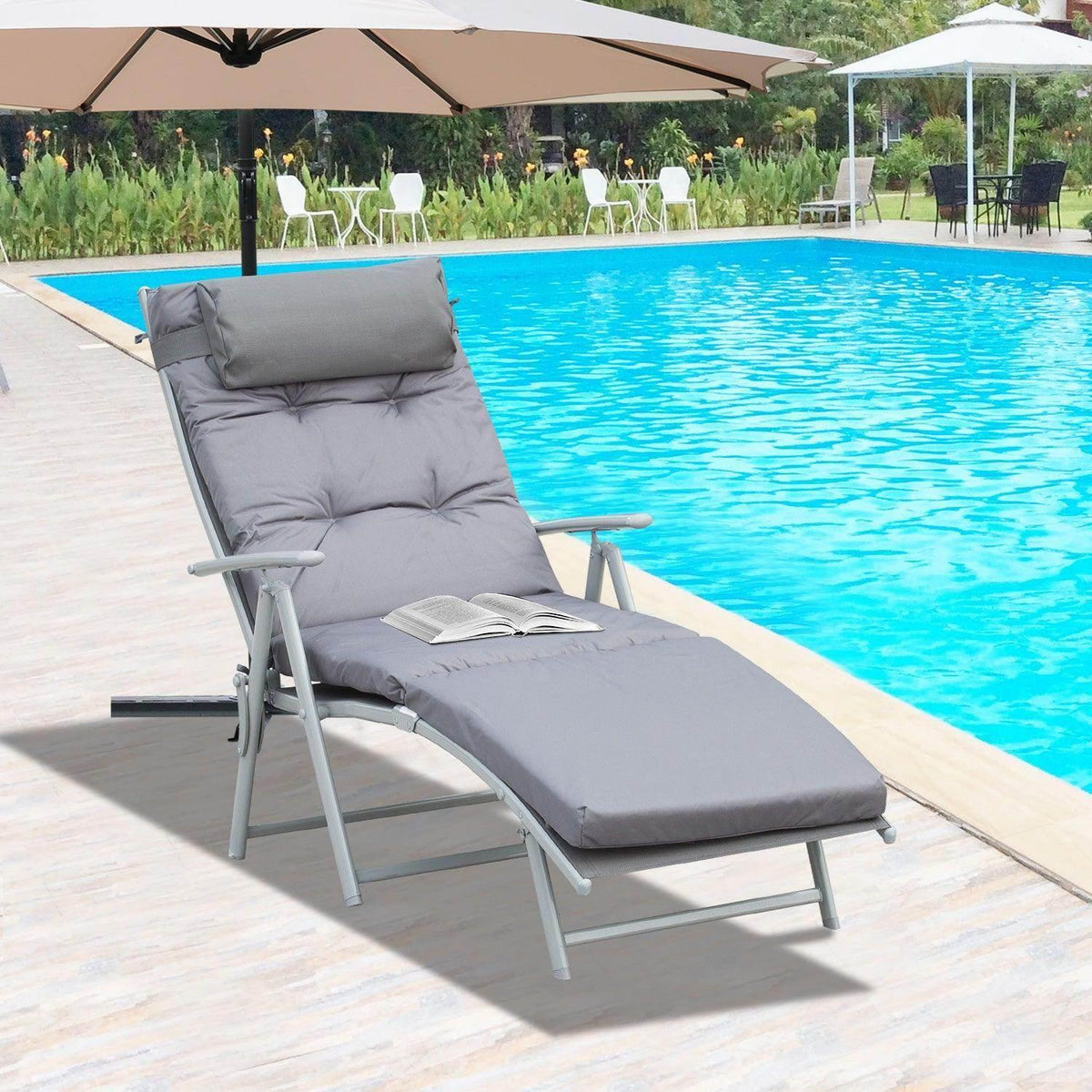 Gray folding sun lounger with padded recline back and headrest, light gray frame