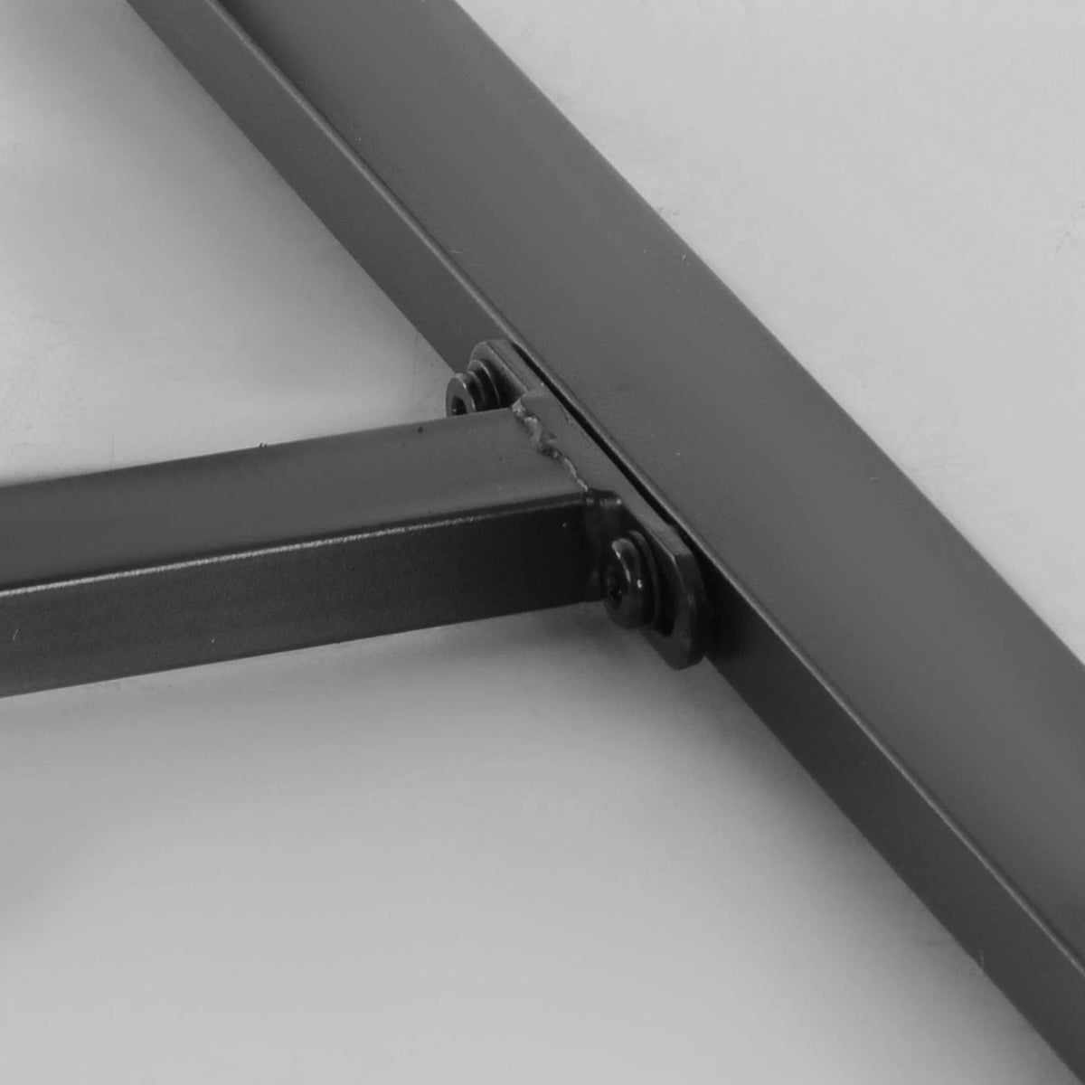 Black metal corner joint on rattan patio furniture frame