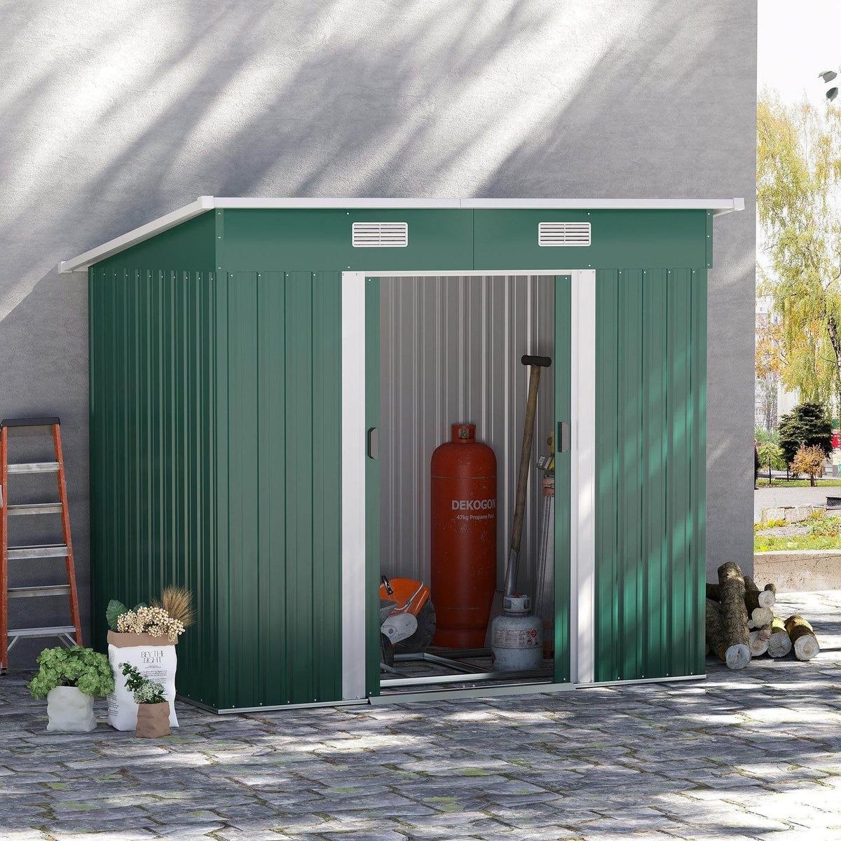 Green metal garden tool storage shed with open double doors and two vent windows