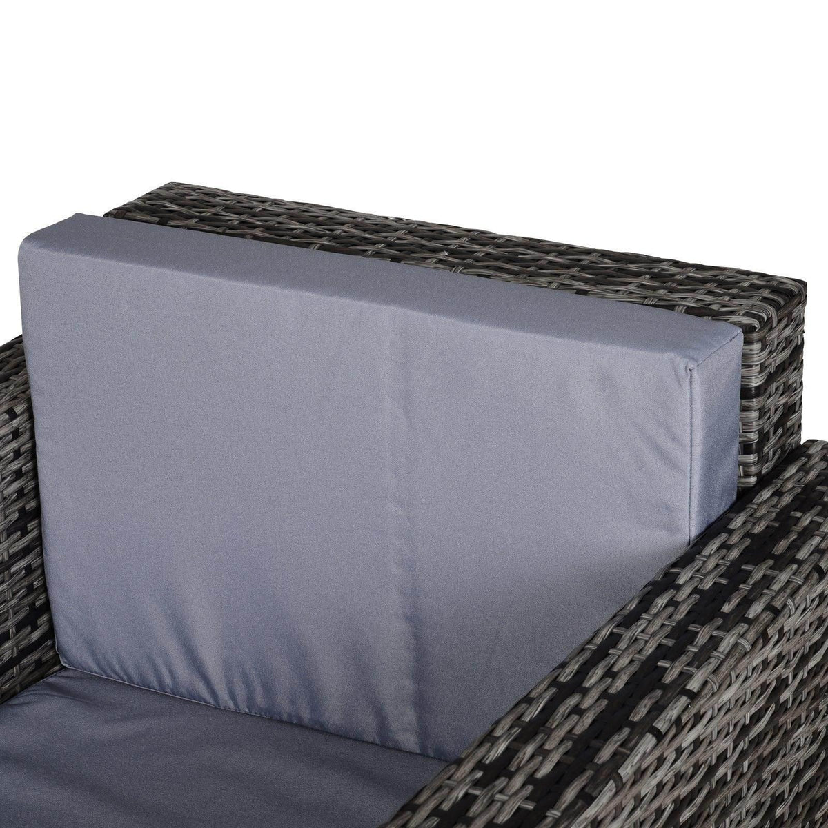 Grey rattan armchair with thick gray backrest and seat cushions