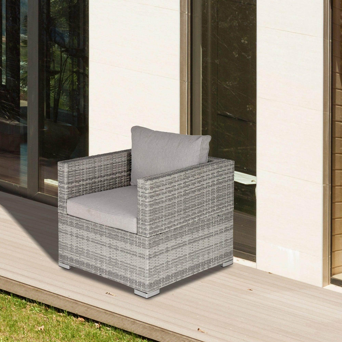 Grey resin rattan patio chair with padded seat and back cushion