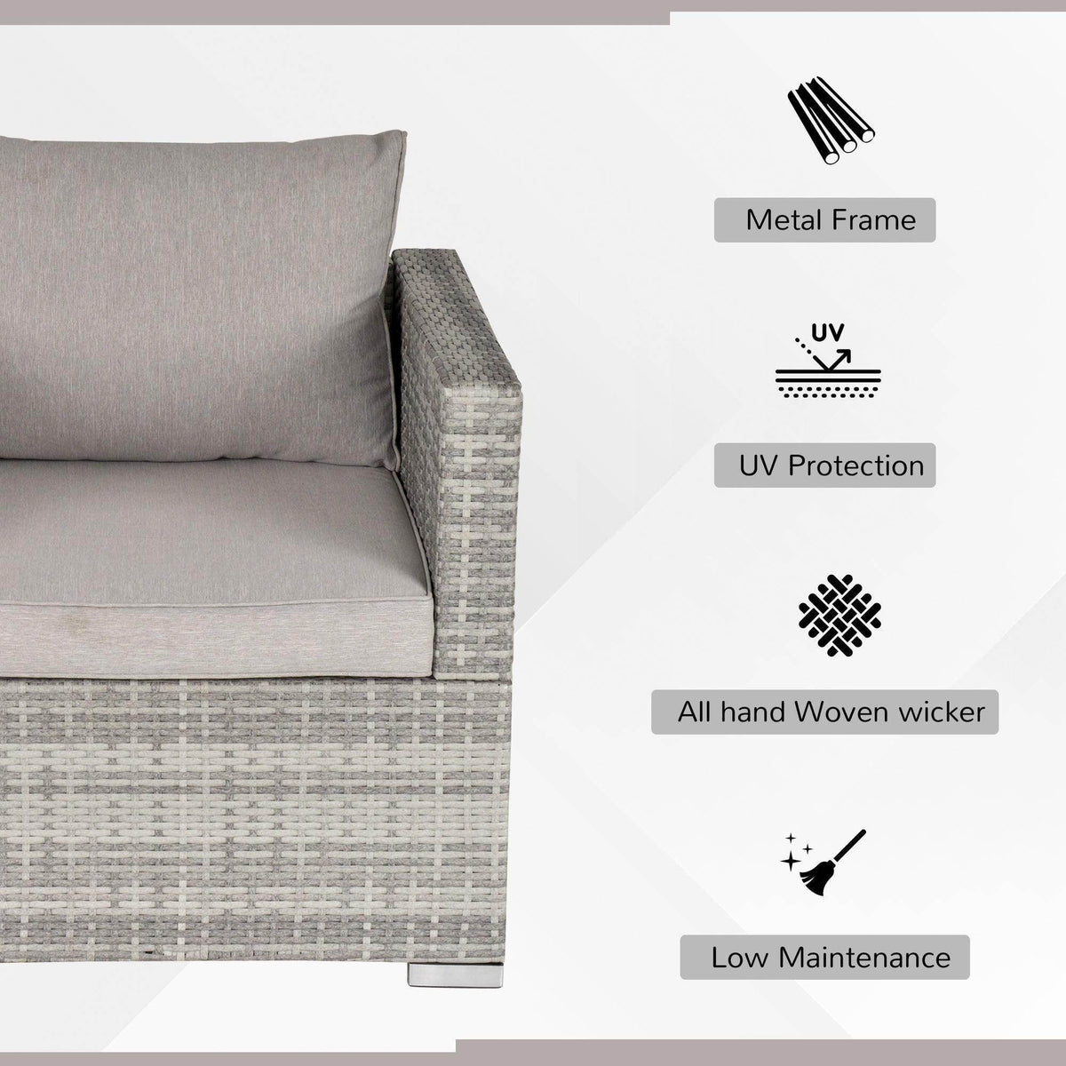 Grey rattan armchair corner with padded back and seat cushions