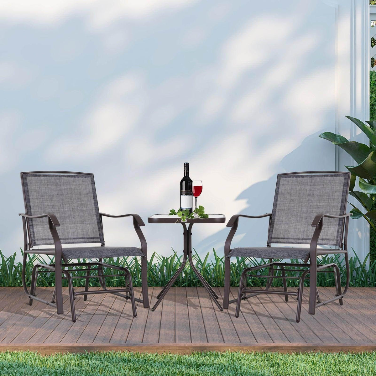 Grey rocking chair and table set with two sling chairs and a glass-topped round table