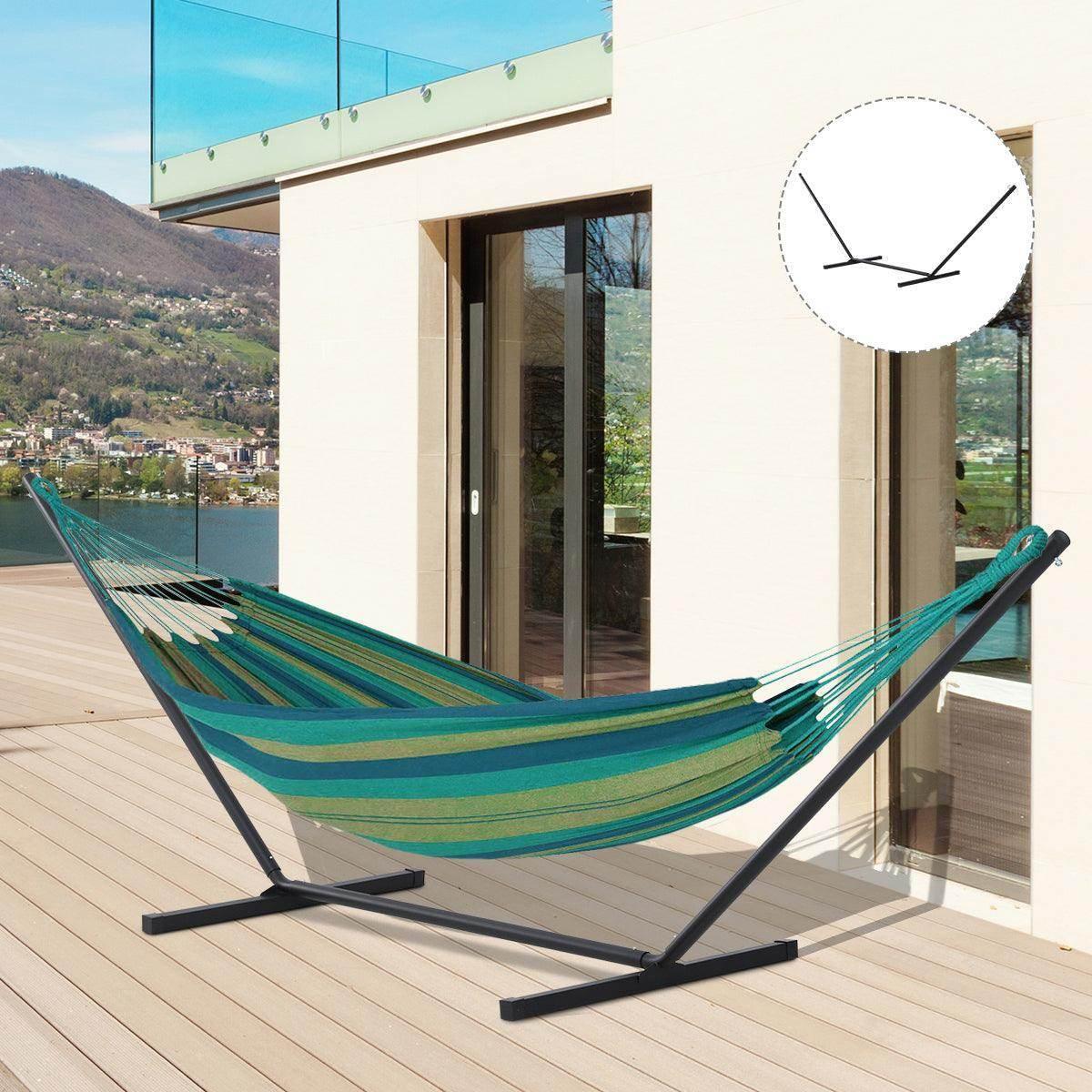 Hammock stand with teal striped hammock and black steel legs on outdoor deck