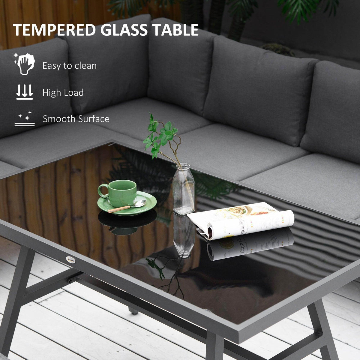Tempered glass tabletop on gray L-shaped outdoor dining set with cushioned seating