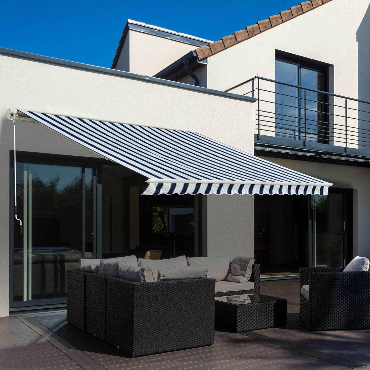 Striped outdoor awning shading patio furniture on modern deck