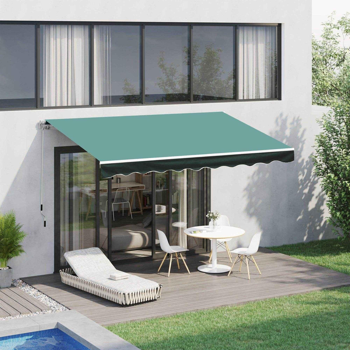 Green retractable patio awning shading outdoor dining set and lounge chair on modern deck near pool