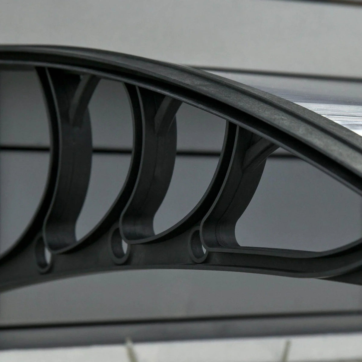Outsunny outdoor door canopy close-up of arched support brackets on black frame