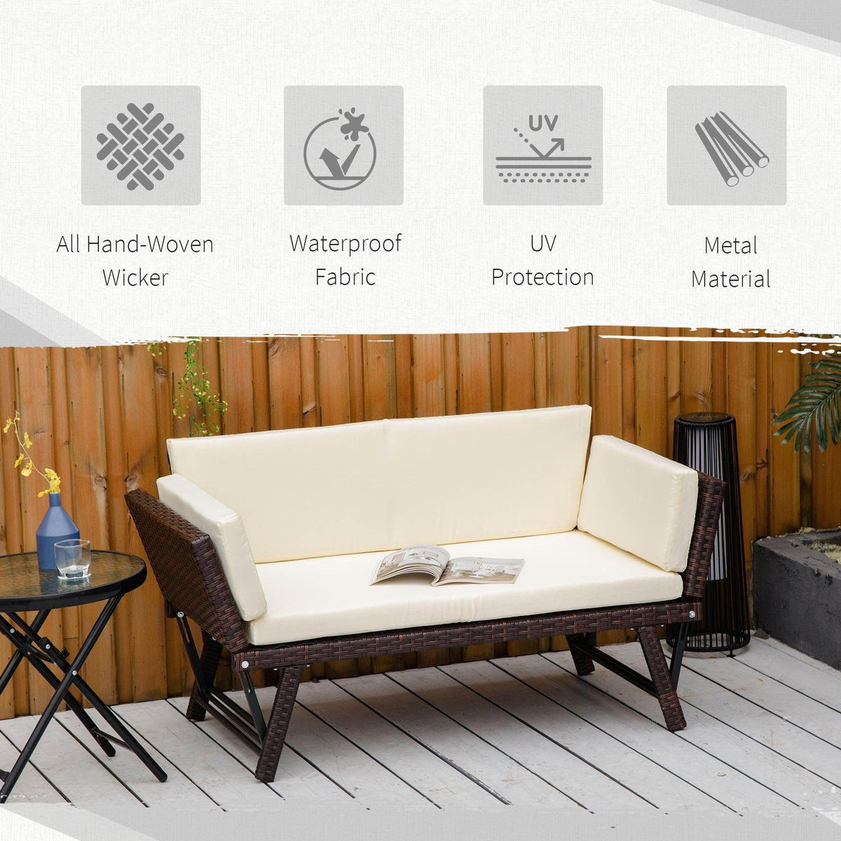 Outdoor folding rattan daybed sofa bench with white seat cushions and dark woven wicker