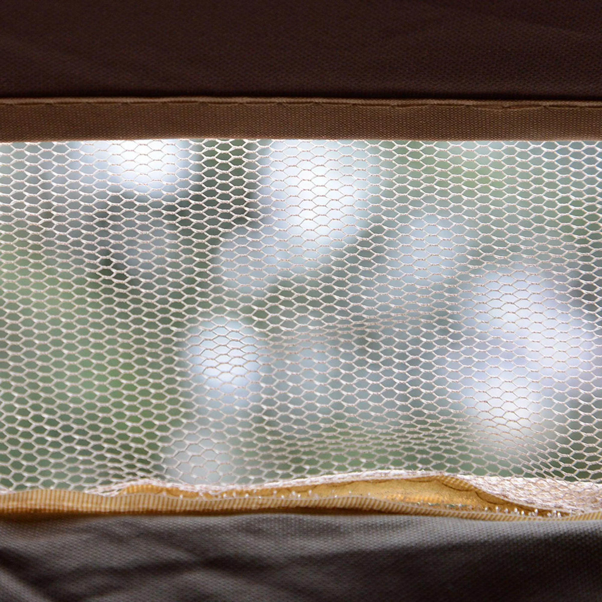 Close-up of gazebo side mesh panel with dark trim and stitched edge