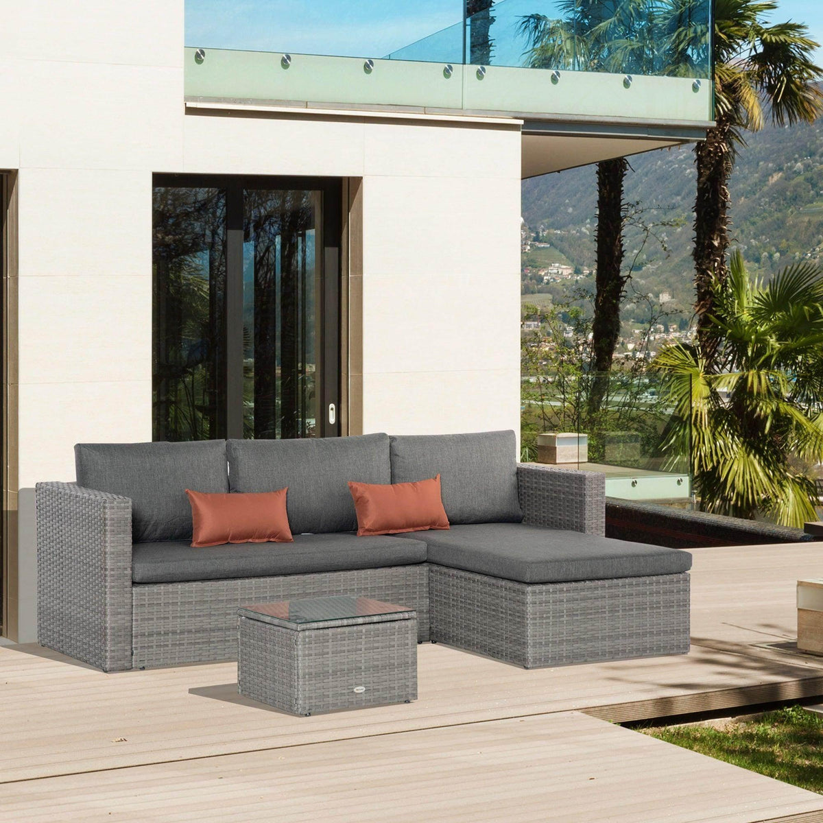 Gray PE rattan corner sofa set with gray cushions and burnt orange throw pillows