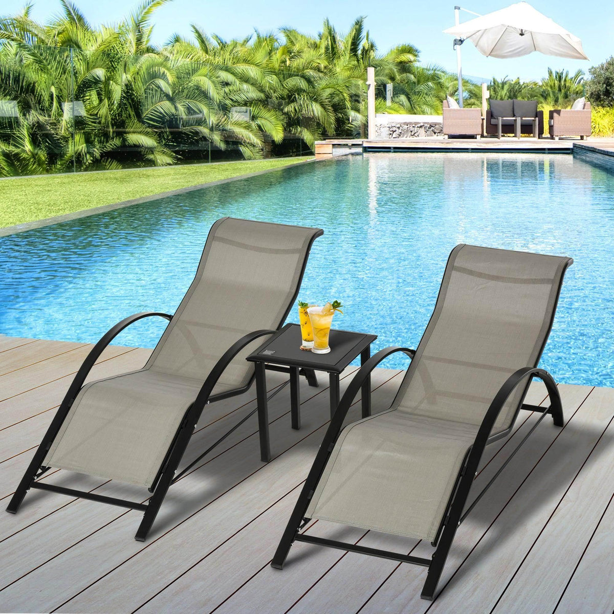 Grey outdoor reclining chairs with black frames and small patio table