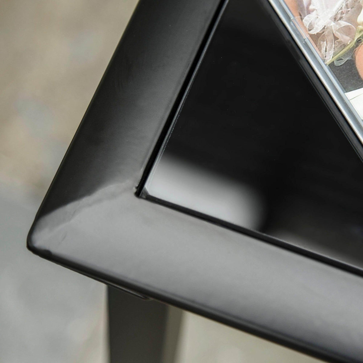 Close-up of grey recliner mesh and black support bar